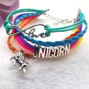 Rainbow multi colored layered Rope unicorn charm Adustible bracelet.
